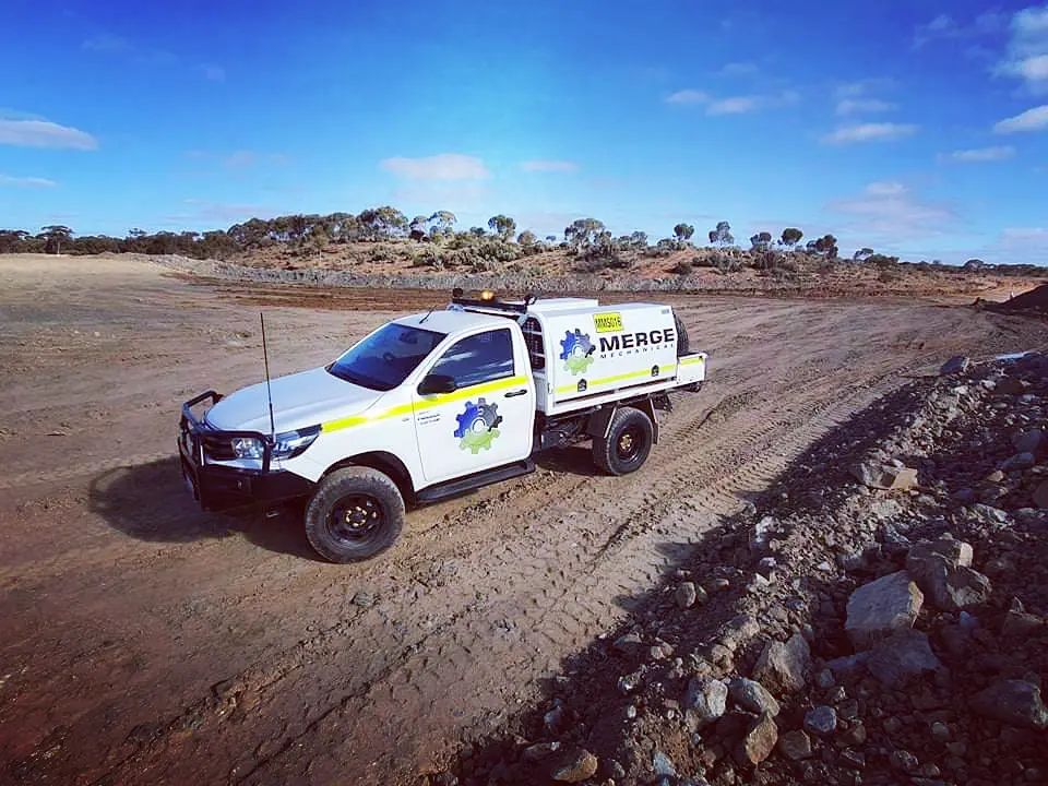 Merge Mechanical service vehicle positioned on a remote mining site, reflecting the company’s expertise in heavy equipment maintenance across challenging terrains.